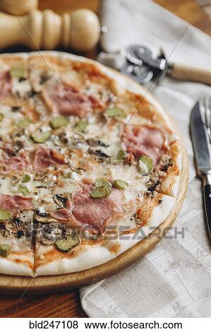 Stock Photo - Pizza pie on table. Fotosearch
