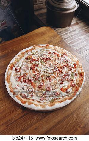 Stock Photography - Pizza pie on table. Fotosearch