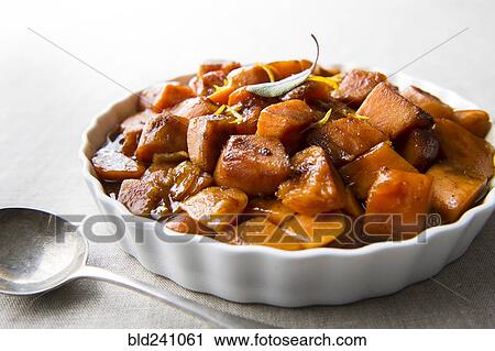 Plate of candied yams and spoon View Large Photo Image Stock Image - Plate of candied yams and spoon. Fotosearch