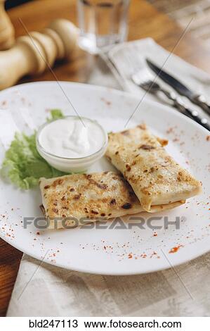 Plate of food on table with dipping sauce View Large Photo Image Stock Image - Plate of food on table with dipping sauce. Fotosearch