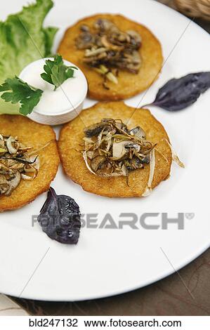 Stock Image - Plate of food with dipping sauce. Fotosearch