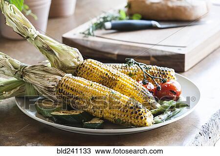 "Plate of grilled corn, tomatoes and zucchini" View Large Photo Image Stock Image - "Plate of grilled corn, tomatoes and zucchini". Fotosearch