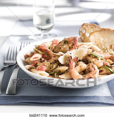 Plate of shrimp and pasta with bread View Large Photo Image Stock Image - Plate of shrimp and pasta with bread. Fotosearch