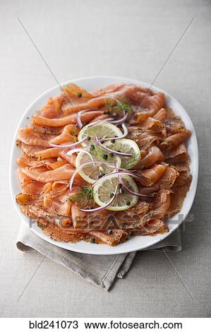 Stock Image - Plate of smoked salmon. Fotosearch