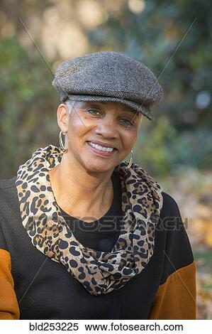 Portrait of African American woman smiling outdoors View Large Photo Image Stock Photography - Portrait of African American woman smiling outdoors. Fotosearch