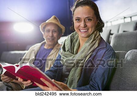 Portrait of Caucasian actors sitting in audience with scripts in theater View Large Photo Image Stock Photography - Portrait of Caucasian actors sitting in audience with scripts in theater. Fotosearch
