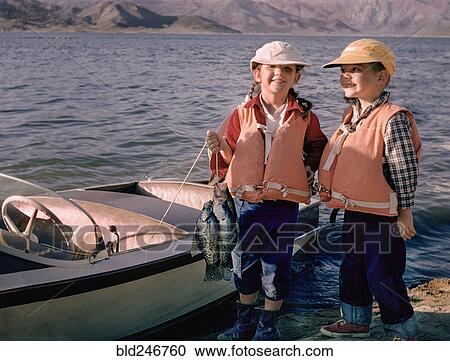 Portrait of Caucasian brother and sister posing with fish near boat View Large Photo Image Stock Image - Portrait of Caucasian brother and sister posing with fish near boat. Fotosearch