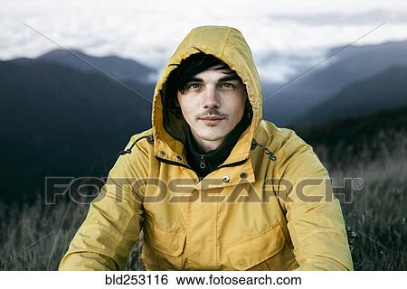 Portrait of Caucasian man in remote mountain landscape View Large Photo Image Stock Photograph - Portrait of Caucasian man in remote mountain landscape. Fotosearch