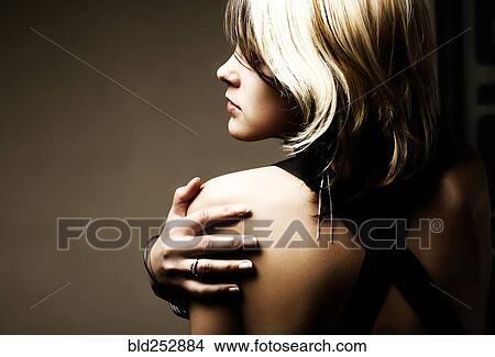 Portrait of Caucasian teenage girl holding shoulder View Large Photo Image Picture - Portrait of Caucasian teenage girl holding shoulder. Fotosearch