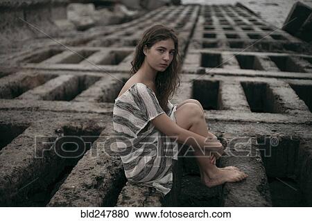 Portrait of Caucasian teenage girl sitting on structure View Large Photo Image Stock Image - Portrait of Caucasian teenage girl sitting on structure. Fotosearch