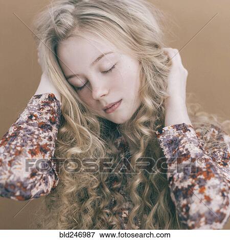 Stock Photo - Portrait of Caucasian teenage girl with blonde hair. Fotosearch