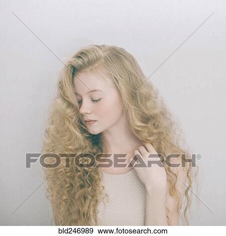 Stock Photo - Portrait of Caucasian teenage girl with blonde hair. Fotosearch