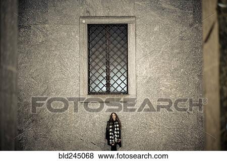 Portrait of Caucasian woman standing under window View Large Photo Image Stock Photo - Portrait of Caucasian woman standing under window. Fotosearch