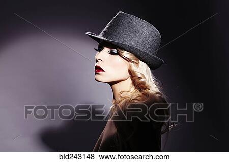Portrait of Caucasian woman wearing fedora View Large Photo Image Stock Photo - Portrait of Caucasian woman wearing fedora. Fotosearch