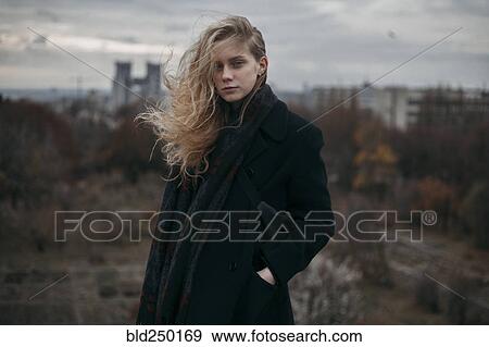 Portrait of Caucasian woman with hair blowing in wind View Large Photo Image Stock Photo - Portrait of Caucasian woman with hair blowing in wind. Fotosearch