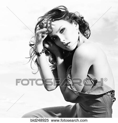 Stock Photography - Portrait of Caucasian woman with hand in hair. Fotosearch