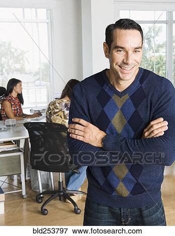 Stock Photo - Portrait of confident man in casual office. Fotosearch