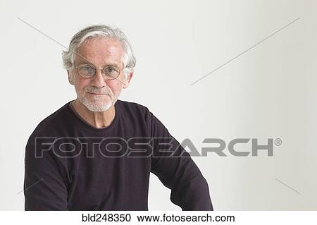 Stock Image - Portrait of confident older Caucasian man. Fotosearch