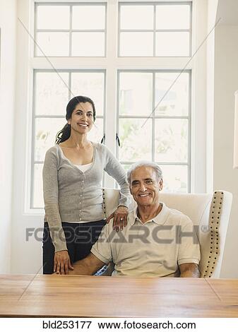 Portrait of couple posing near window View Large Photo Image Stock Photo - Portrait of couple posing near window. Fotosearch