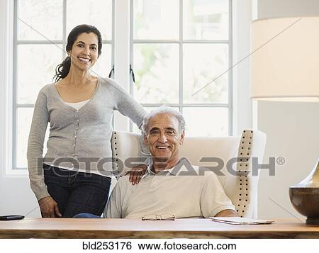 Portrait of couple posing near window View Large Photo Image Stock Photograph - Portrait of couple posing near window. Fotosearch