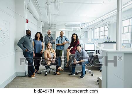Stock Image - Portrait of diverse business people in office. Fotosearch
