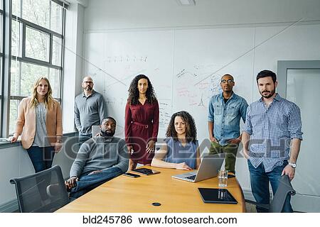Stock Photograph - Portrait of diverse business people in conference room. Fotosearch