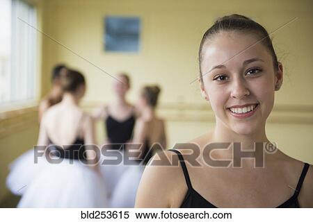 Stock Photography - Portrait of girl smiling in ballet studio. Fotosearch