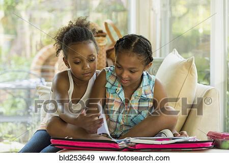 Portrait of girls doing homework View Large Photo Image Stock Photo - Portrait of girls doing homework. Fotosearch