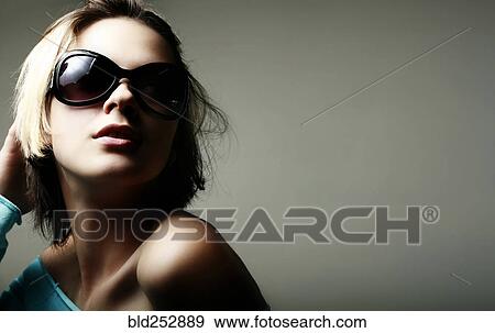 Portrait of glamorous Caucasian teenage girl wearing sunglasses View Large Photo Image Stock Photo - Portrait of glamorous Caucasian teenage girl wearing sunglasses. Fotosearch