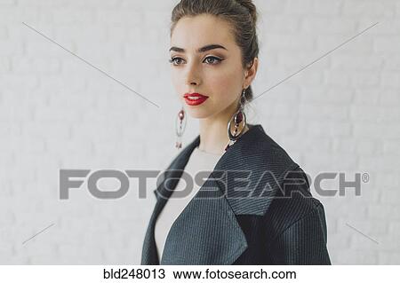Portrait of glamorous Middle Eastern woman wearing earrings View Large Photo Image Stock Image - Portrait of glamorous Middle Eastern woman wearing earrings. Fotosearch