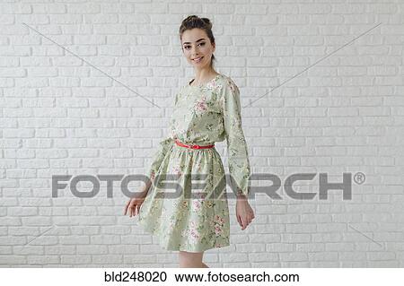 Portrait of glamorous Middle Eastern woman standing near wall View Large Photo Image Stock Image - Portrait of glamorous Middle Eastern woman standing near wall. Fotosearch