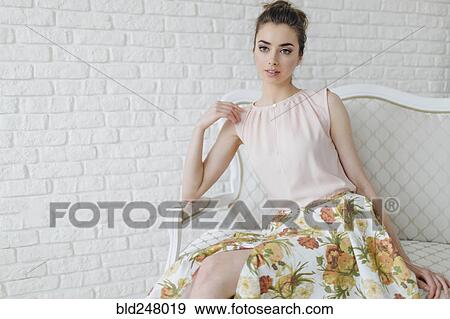 Portrait of glamorous Middle Eastern woman sitting on bench View Large Photo Image Stock Photo - Portrait of glamorous Middle Eastern woman sitting on bench. Fotosearch