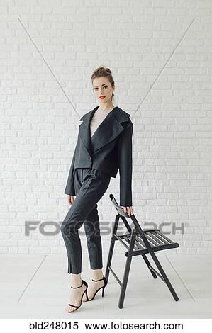 Portrait of glamorous Middle Eastern woman leaning on chair View Large Photo Image Stock Photography - Portrait of glamorous Middle Eastern woman leaning on chair. Fotosearch