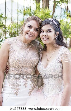 Stock Photo - Portrait of Hispanic girl and mother. Fotosearch