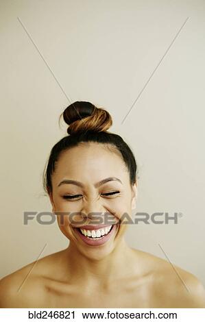 Stock Image - Portrait of laughing Asian woman. Fotosearch