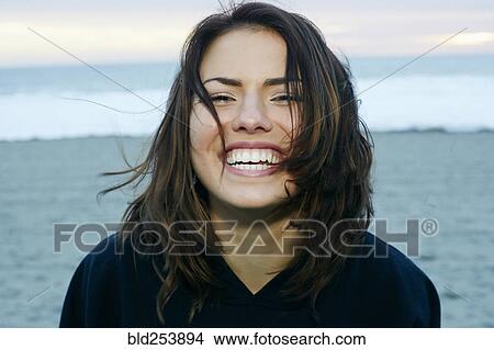 Picture - Portrait of laughing Caucasian woman at beach. Fotosearch