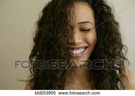 Portrait of laughing Mixed Race woman with eyes closed View Large Photo Image Stock Photography - Portrait of laughing Mixed Race woman with eyes closed. Fotosearch