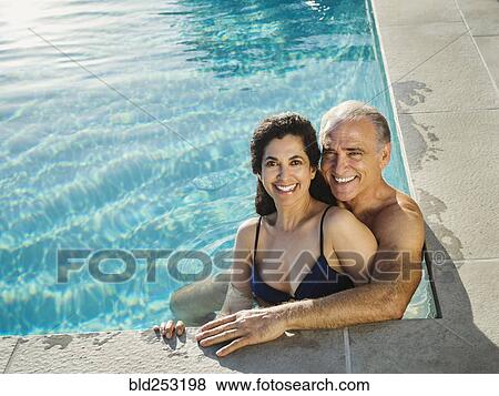 Portrait of older couple relaxing in swimming pool View Large Photo Image Stock Photo - Portrait of older couple relaxing in swimming pool. Fotosearch