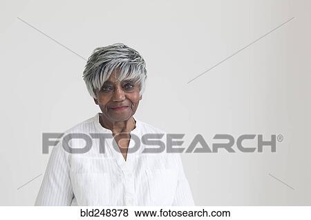 Portrait of older smiling Black woman View Large Photo Image Stock Photo - Portrait of older smiling Black woman. Fotosearch