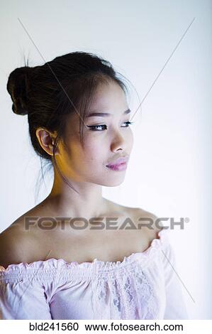 Portrait of pensive Asian woman View Large Photo Image Stock Image - Portrait of pensive Asian woman. Fotosearch