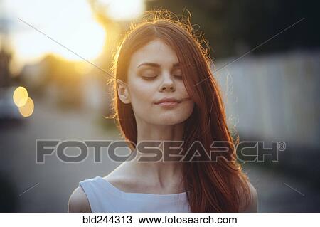 Stock Image - Portrait of pensive Caucasian woman. Fotosearch