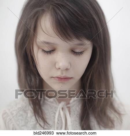 Stock Image - Portrait of sad Caucasian girl. Fotosearch
