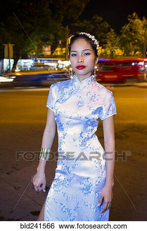 Stock Photograph - Portrait of serious Asian woman wearing traditional clothing. Fotosearch