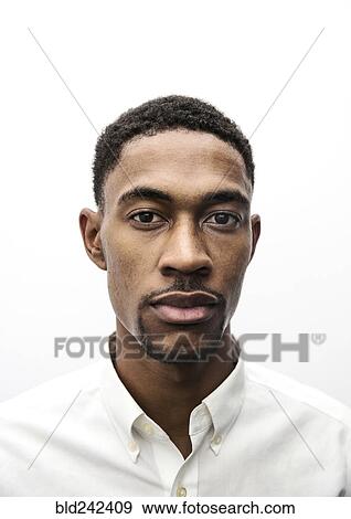 Stock Photo - Portrait of serious Black man. Fotosearch