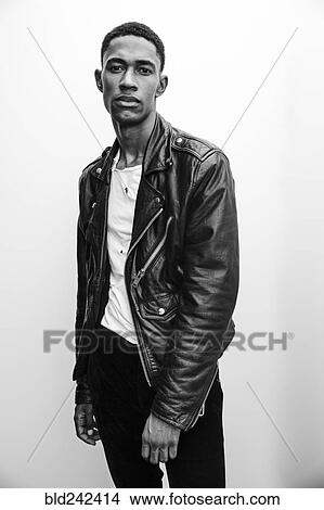 Picture - Portrait of serious Black man wearing leather jacket. Fotosearch