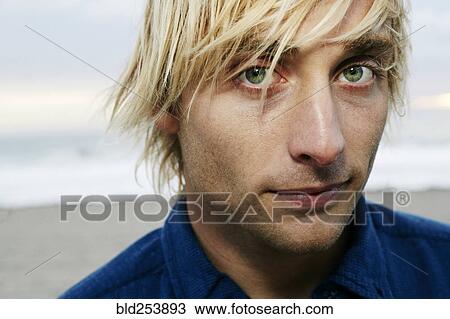 Portrait of serious Caucasian man at beach View Large Photo Image Stock Image - Portrait of serious Caucasian man at beach. Fotosearch