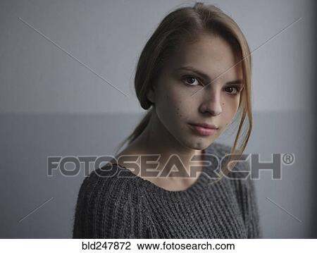 Stock Image - Portrait of serious Caucasian teenage girl. Fotosearch