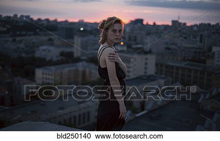 Portrait of serious Caucasian teenage girl overlooking cityscape View Large Photo Image Stock Image - Portrait of serious Caucasian teenage girl overlooking cityscape. Fotosearch