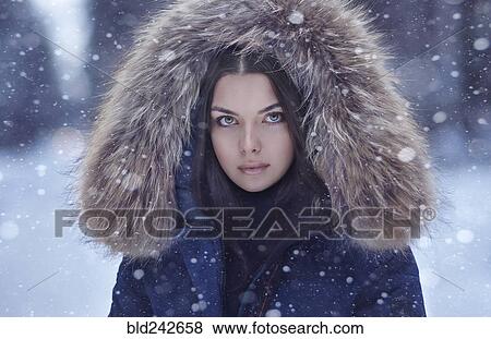 Stock Photo - Portrait of serious Caucasian woman in winter. Fotosearch