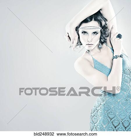 Portrait of serious Caucasian woman wearing headband View Large Photo Image Stock Image - Portrait of serious Caucasian woman wearing headband. Fotosearch